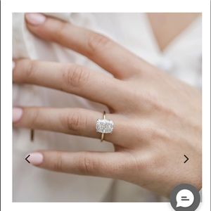 3.2 Carat, elongated cushion cut engagement ring.